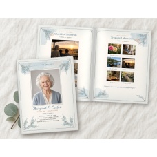 Printed and folded Celebration of Life 11x17 funeral program booklet with a filled-in sample: a cover portrait, name and service details, beside the open Cherished Moments and Treasured Memories photo pages