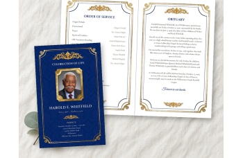 Memorial Plaque bifold funeral program mockup on linen: the navy cover, with a photo of a smiling older man in a gold plaque frame, beside the open inside spread.