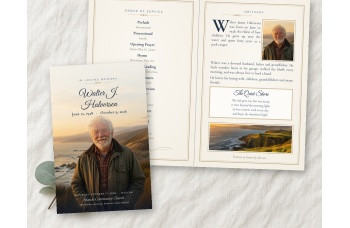 Quiet Shore bifold funeral program mockup on linen, folded cover with a full-bleed coastal photo of an older bearded man beside the open inside spread.
