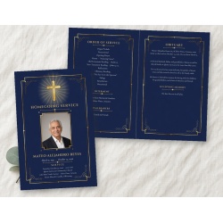 Classic Cross bifold funeral program mockup on linen: the navy and gold front cover, with a gold cross and light rays above "Homegoing Service", a framed photo spot, the name and dates, in front of the open inside pages with the order of service and obitu