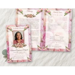 Pastel Memories bifold funeral program mockup on linen, the folded cover with a photo of a smiling older woman framed in rose gold beside the open inside spread.